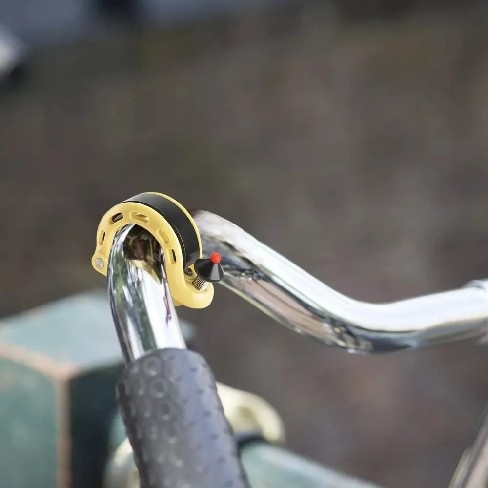 Campainha de bicicleta em forma de Q